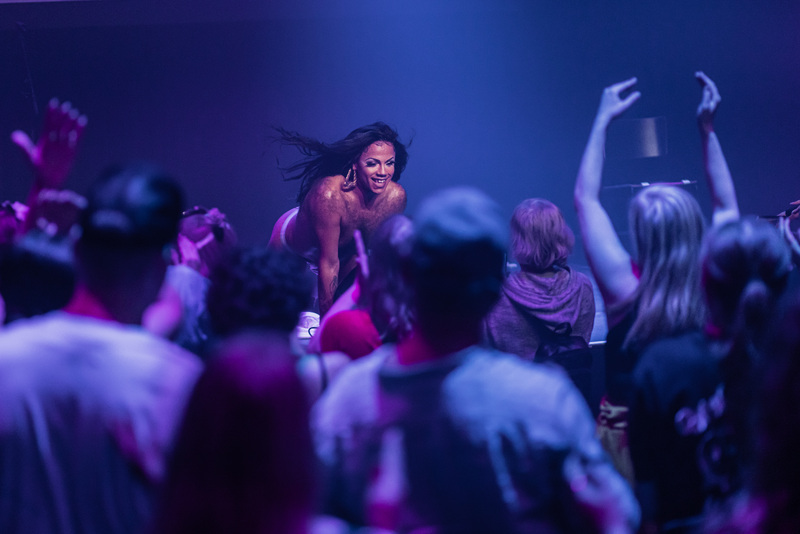 Tina Hyena beams on stage as the crowd goes wild at ANTI Festival in Kuopio, Finland as part of Brownton Abbey the afrofuturistic space church themed performance party celebrating and elevating queer disabled artists of colour.